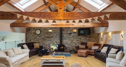 Beautiful old barn converted into holiday accommodation with a woodfired hot tub