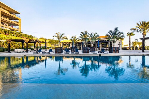 Modern apartment with. ocean view, pool, patio, tennis, & gym