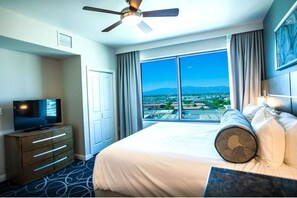 Enjoy a city view from the comfort of this stylish room, featuring a large bed and a flat-screen TV.