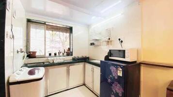 Fridge, microwave, cookware/dishes/utensils