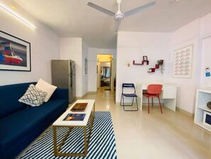 Living area - Nature Inspired Sun Drenched 1BR in Bandra (Mumbai)