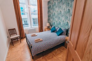 1 bedroom, desk, iron/ironing board, travel cot