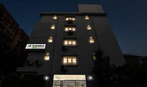 A multi-story building with a sign for 'treebo trend Sapphire Asta'. - Treebo Emerald (Hyderabad)