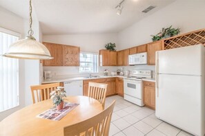 Enjoy cooking in this well-equipped kitchen with an oven, microwave, and refrigerator.