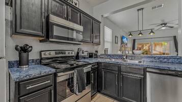 Townhome, Multiple Beds, Patio, Garden View (Memory Maker at Regal Palms Resort) | Private kitchen | Fridge, microwave, oven, stovetop