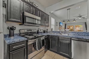 Townhome, Multiple Beds, Patio, Garden View (Memory Maker at Regal Palms Resort) | Private kitchen | Fridge, microwave, oven, stovetop