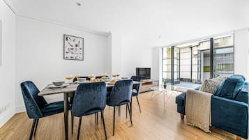 City Apartment | Living area | 40-inch Smart TV with satellite channels