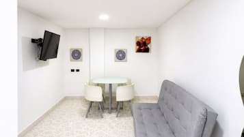 Family Apartment, 2 Bedrooms, City View | Living area | 43-inch flat-screen TV with satellite channels, Netflix