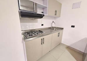 Classic Apartment, Housekeeping, City View | Private kitchen | Griddle - Hotel Ofix - Laureles (Medellín)
