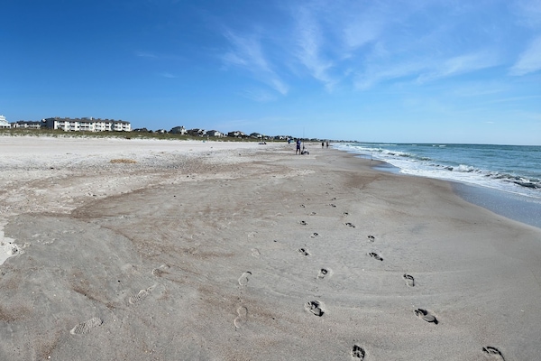 On the beach, sun loungers