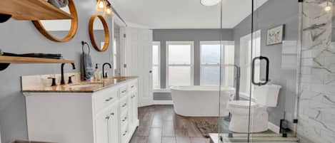 Bathtub, hair dryer, towels, shampoo