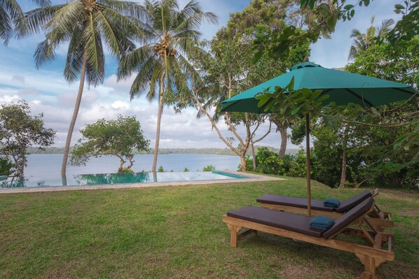 Outdoor pool, open 6:00 AM to 9:00 PM, free cabanas, pool umbrellas