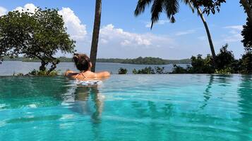 Outdoor pool, open 6:00 AM to 9:00 PM, free pool cabanas, pool umbrellas