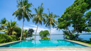 Outdoor pool, open 6:00 AM to 9:00 PM, free cabanas, pool umbrellas