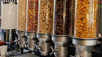 A row of cereal dispensers with various grains and flakes.