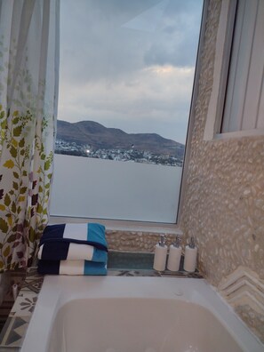 Jetted bath, hair dryer, towels, soap