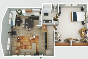Un appartement de deux chambres comprenant un salon, un coin repas, une cuisine et une salle de bain.