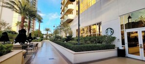 Relax in our serene outdoor space, surrounded by lush greenery and comfortable seating areas.
