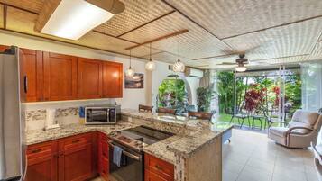 Condo, 1 King Bed with Sofa bed, Lanai, Garden View | Private kitchen | Fridge, microwave, oven, stovetop