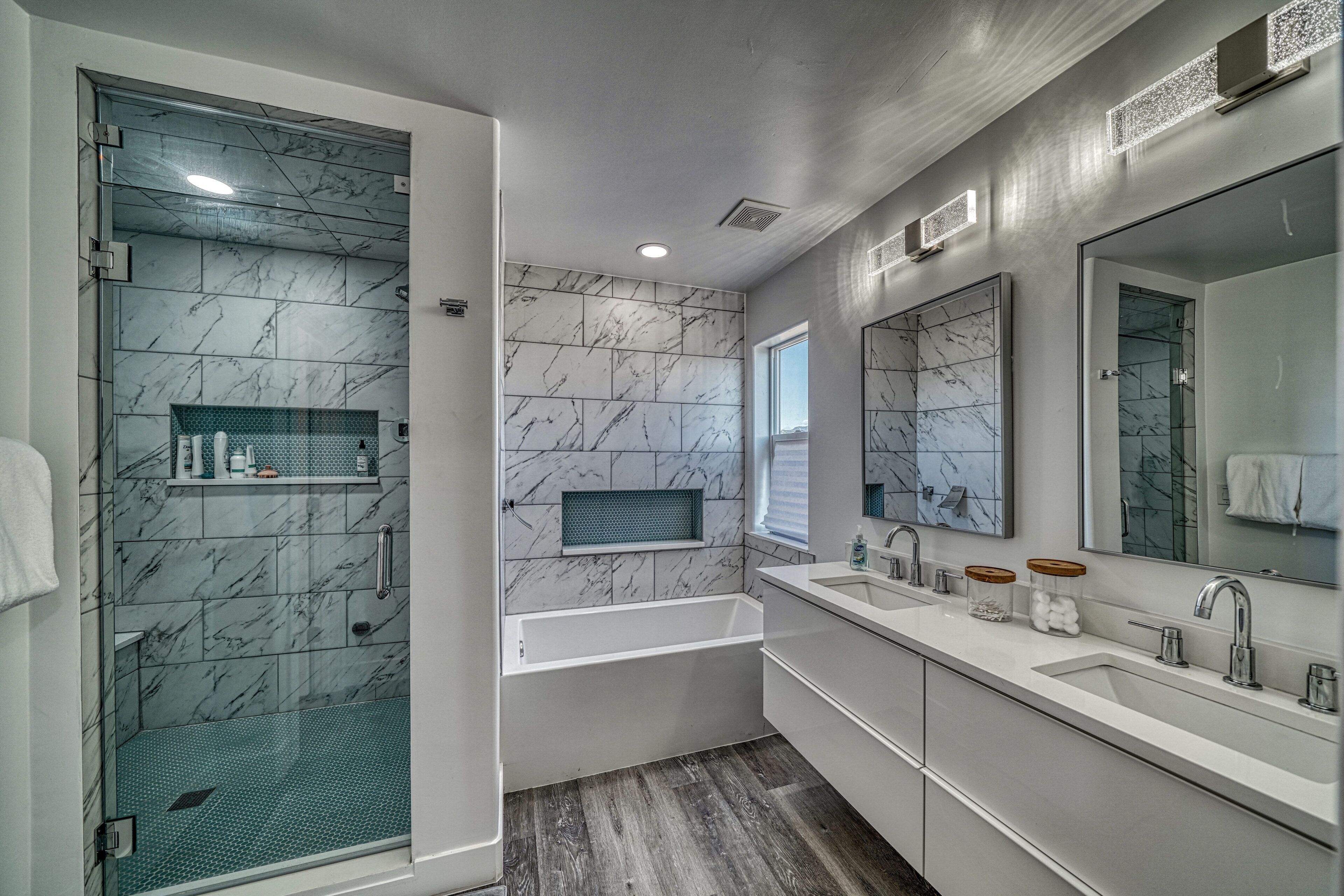 Bathtub, towels, soap, toilet paper