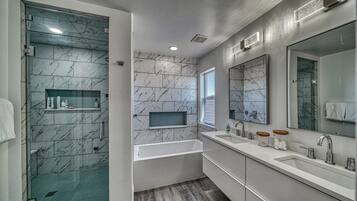 Bathtub, towels, soap, toilet paper