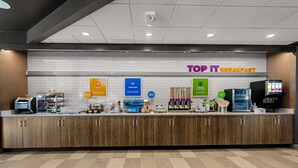 A breakfast counter with a sign reading "TOP IT BREAKFAST" and various food options displayed. - Tru By Hilton Christiansburg (Christiansburg)