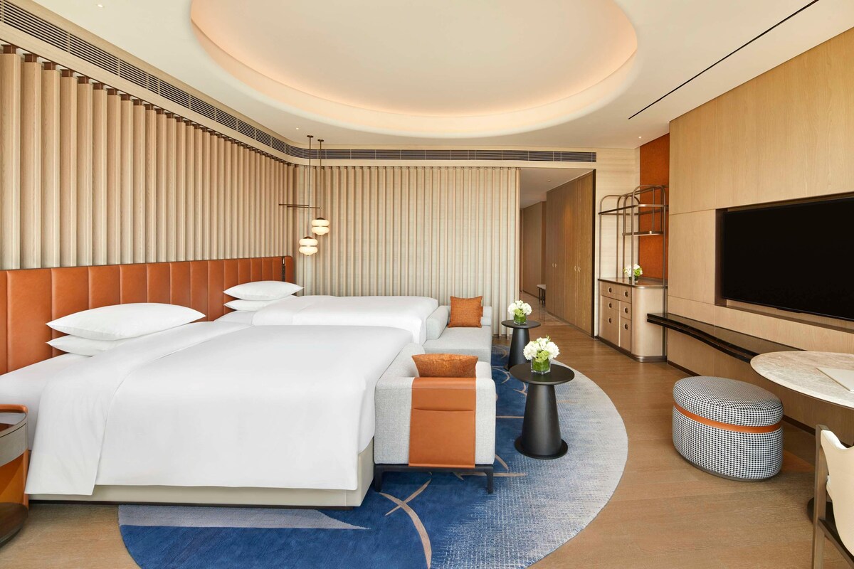 Luxe beddengoed, donsdekens, pillowtop-bedden, een minibar