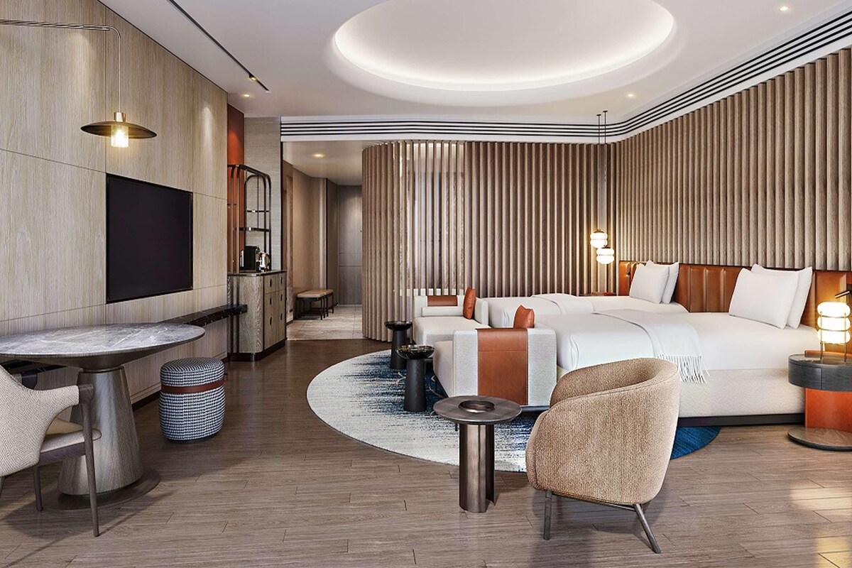 Luxe beddengoed, donsdekens, pillowtop-bedden, een minibar