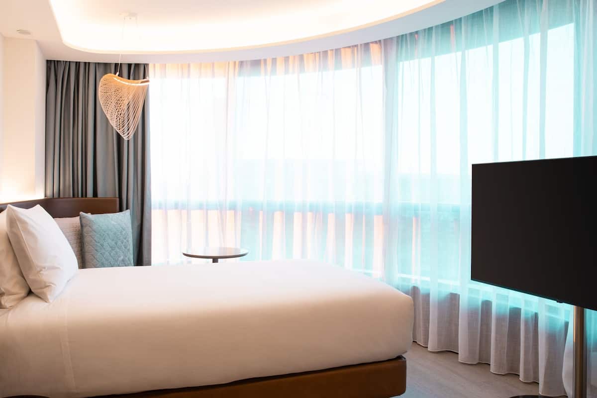 Chambre, 1 lit une place | Minibar, coffres-forts dans les chambres, bureau, rideaux occultants