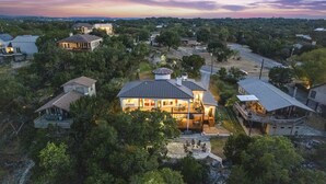 A large house with multiple rooms, a patio, and a view of the surrounding area. - Riviera Paradise | Lake Access (Canyon Lake)