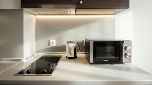 Fridge, microwave, stovetop, cookware/dishes/utensils