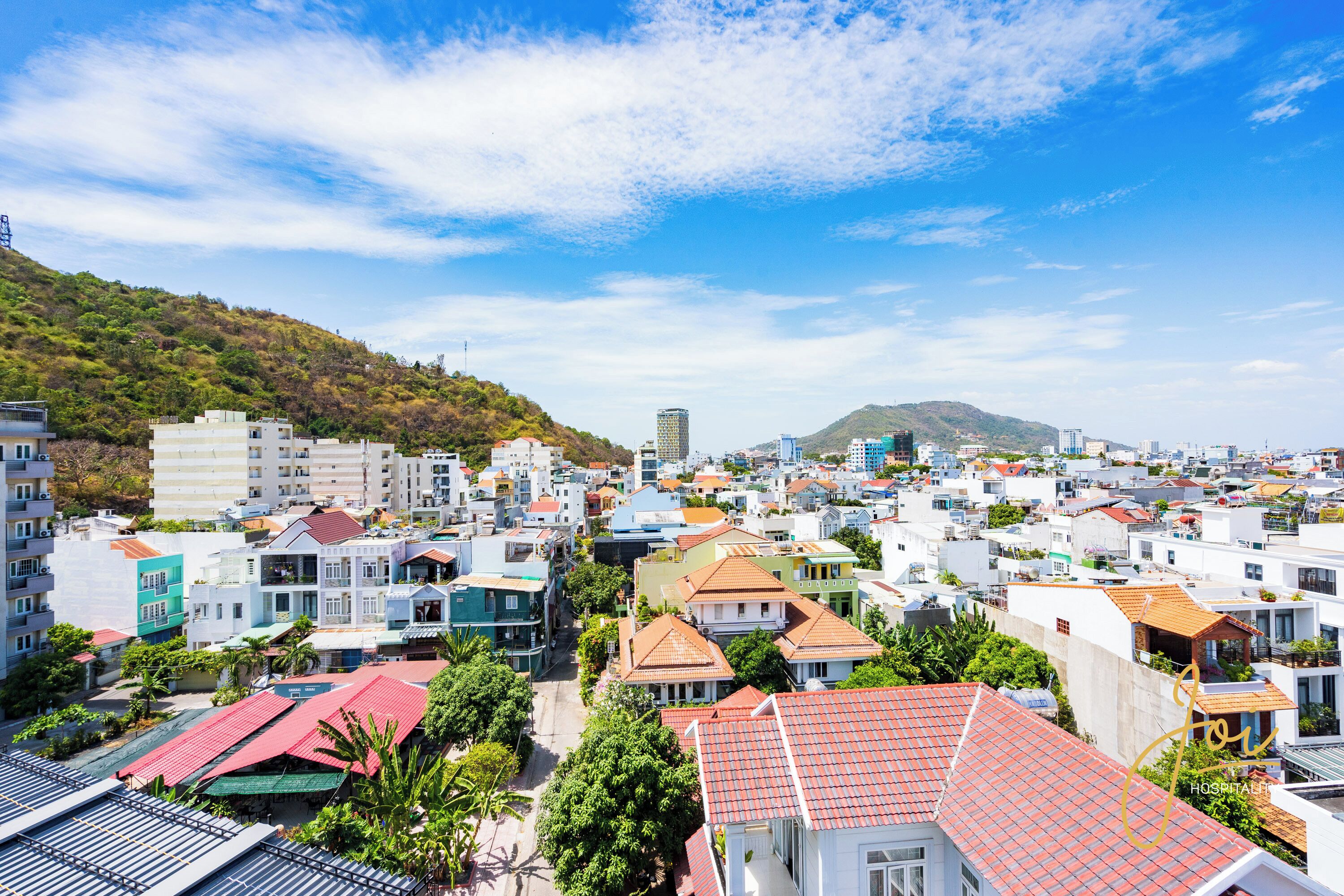 A coastal town with a variety of buildings, including residential and commercial structures.