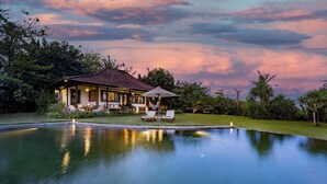 A house with a swimming pool, lounge chairs, and a gazebo. - Bali Amori Vista (Cemagi)