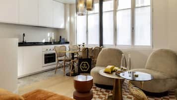 Deluxe Apartment | Living area | 12-inch flat-screen TV with digital channels