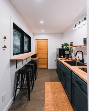 Fridge, microwave, stovetop, coffee/tea maker