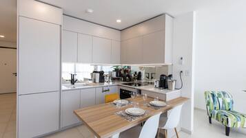 Coffee/tea maker, fridge, microwave, oven