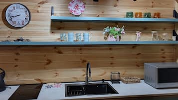Fridge, electric kettle, cookware/dishes/utensils