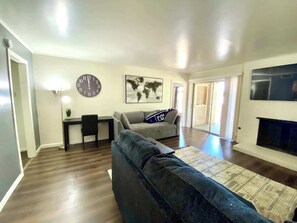 TV, fireplace, books, offices