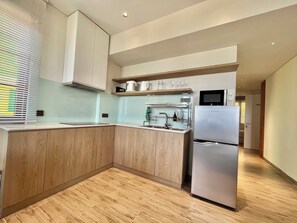 Fridge, microwave, electric kettle, cookware/dishes/utensils