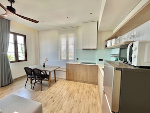 Fridge, microwave, electric kettle, cookware/dishes/utensils