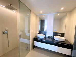 Shower, hair dryer, towels, toilet paper