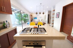 Fridge, microwave, stovetop, coffee/tea maker