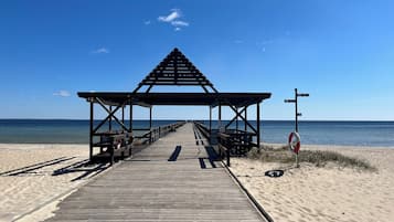 On the beach, white sand, 2 beach bars