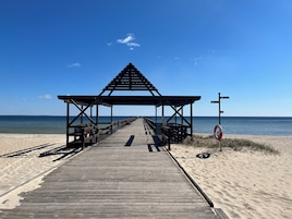 On the beach, white sand, 2 beach bars