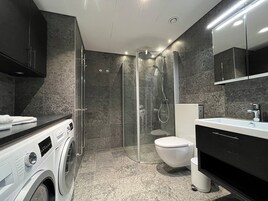 Exclusive Apartment | Bathroom | Shower, rainfall showerhead, hair dryer, towels