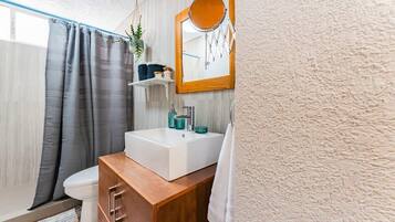 Shower, hair dryer, towels, shampoo