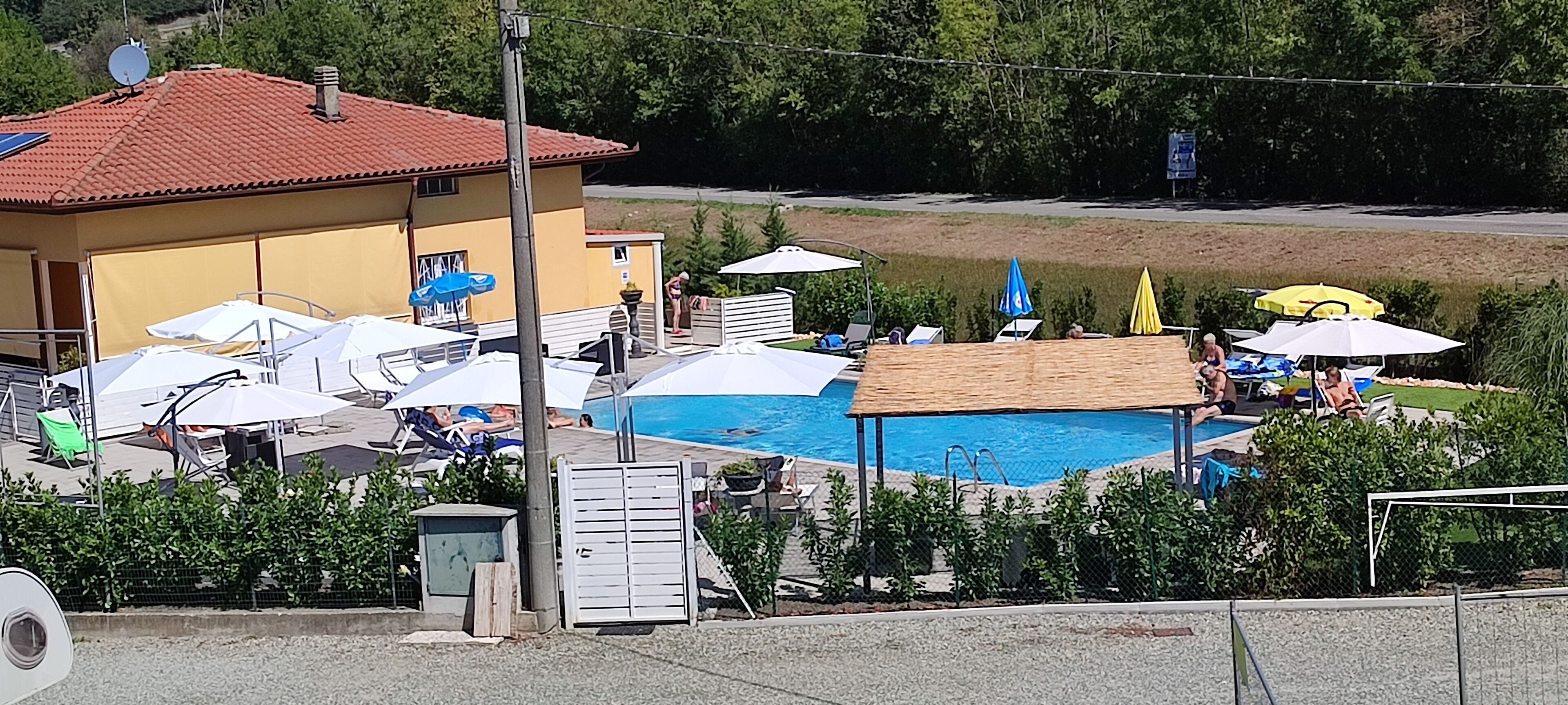 Seasonal outdoor pool, open 9:00 AM to 7:00 PM, pool umbrellas