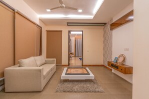 Deluxe Villa | Living area | 42-inch LED TV with cable channels - Truliv Villa Ivory  (Tirupporur)