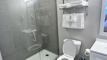 Combined shower/tub, hair dryer, towels, soap