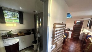 A compact kitchen with a sink, stove, and a window. - Au fil de Leau (Plobsheim)
